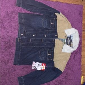 A brand NEW jean jacket with Fur at the collar!